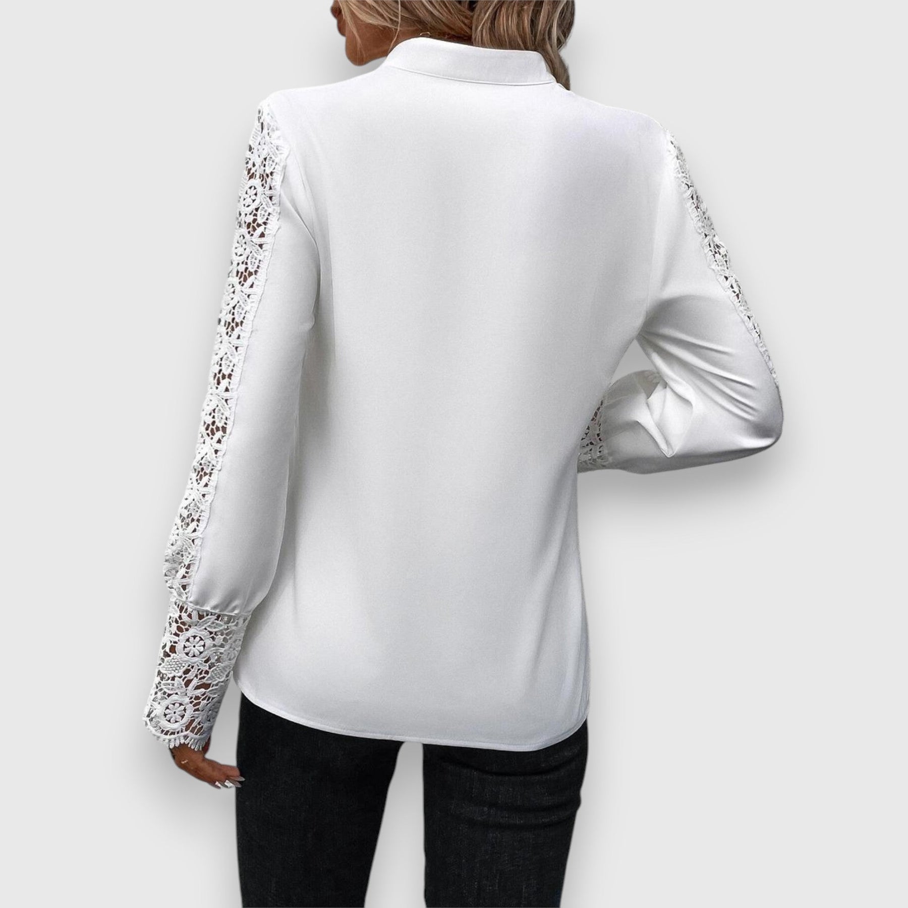 White long-sleeve blouse back view with lace sleeve trim