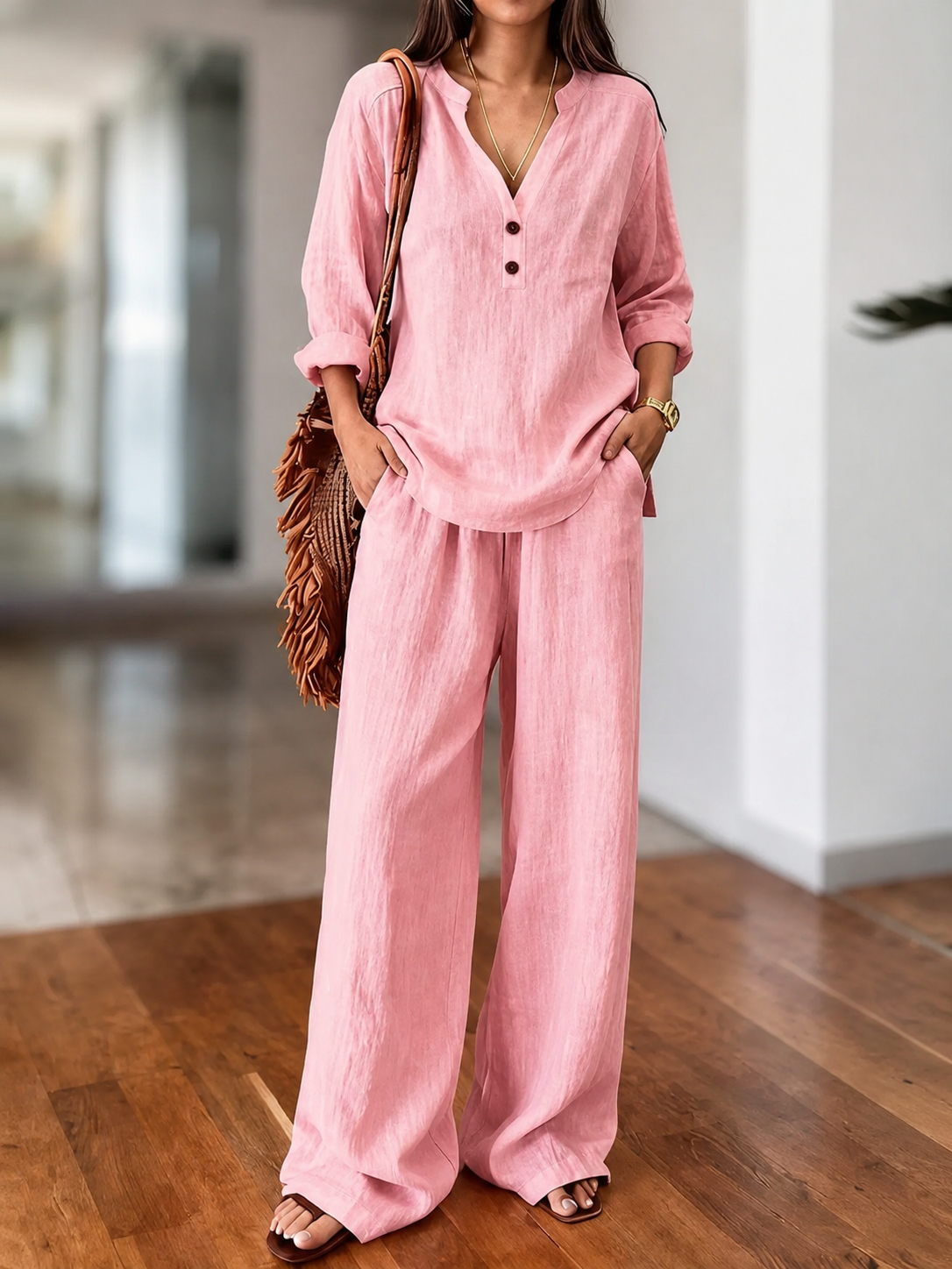 Pink long-sleeve two-piece set with V-neck tunic top and loose wide-leg pants
