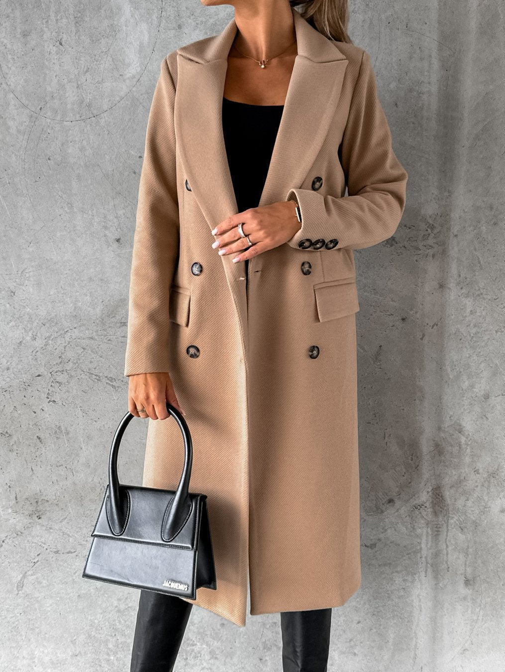 Camel long double-breasted coat with notched lapel, front buttons, flap pockets