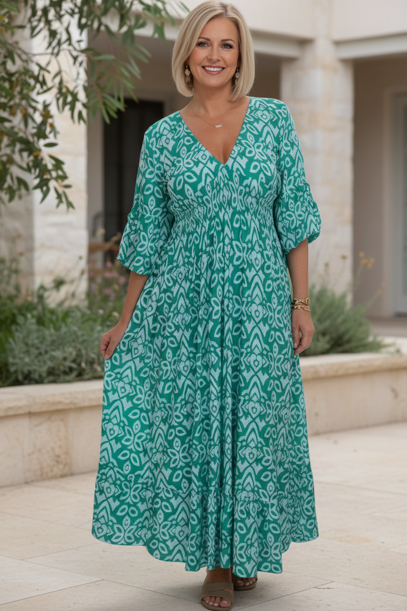 Teal blue bohemian dress with white pattern, V-neck, gathered waist, 3/4 sleeves