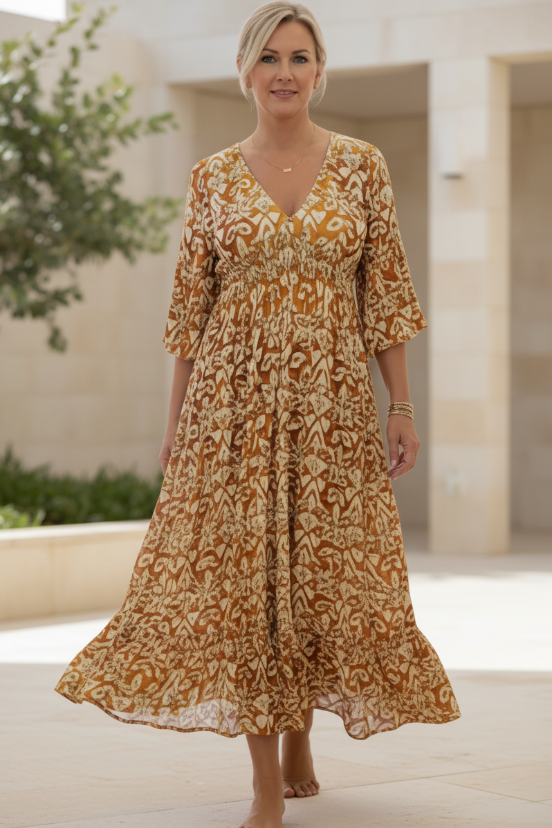 Warm orange bohemian dress with cream pattern, V-neck, gathered waist, 3/4 sleeves