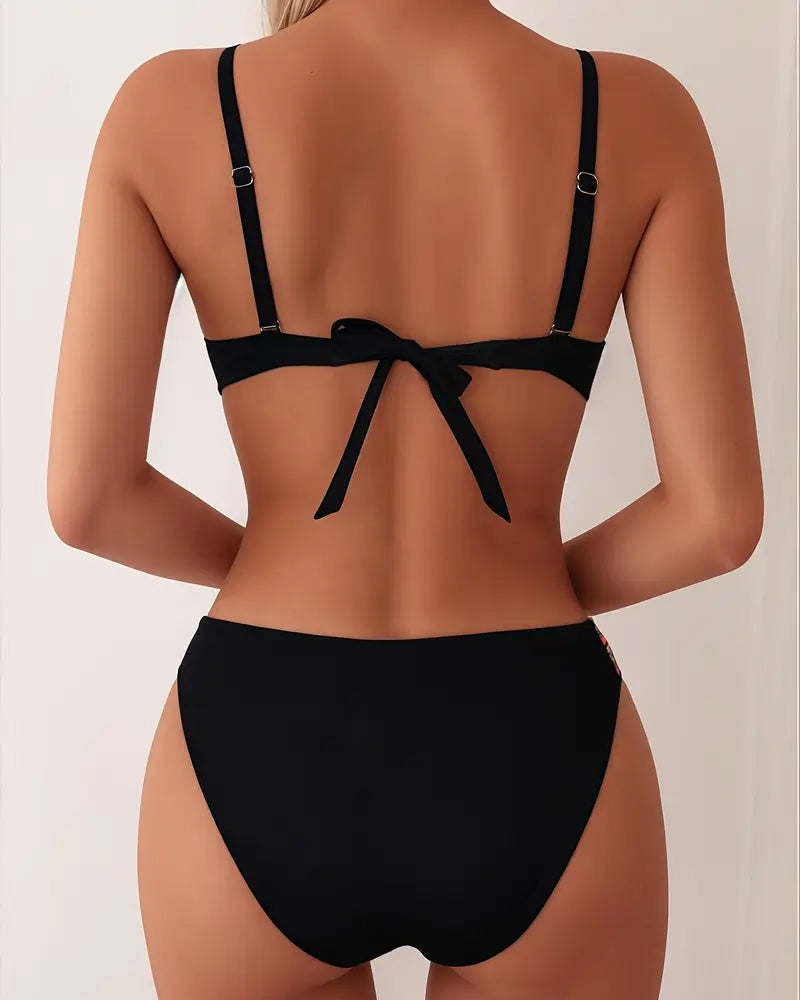 Black backless bikini set with strappy open back and bow tie at the waist