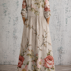 Back view floral maxi dress in light gray with pink rose print, gathered waist, 3/4 sleeves
