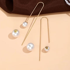 Gold-tone pearl drop earrings with round white pearl beads and thin hooks