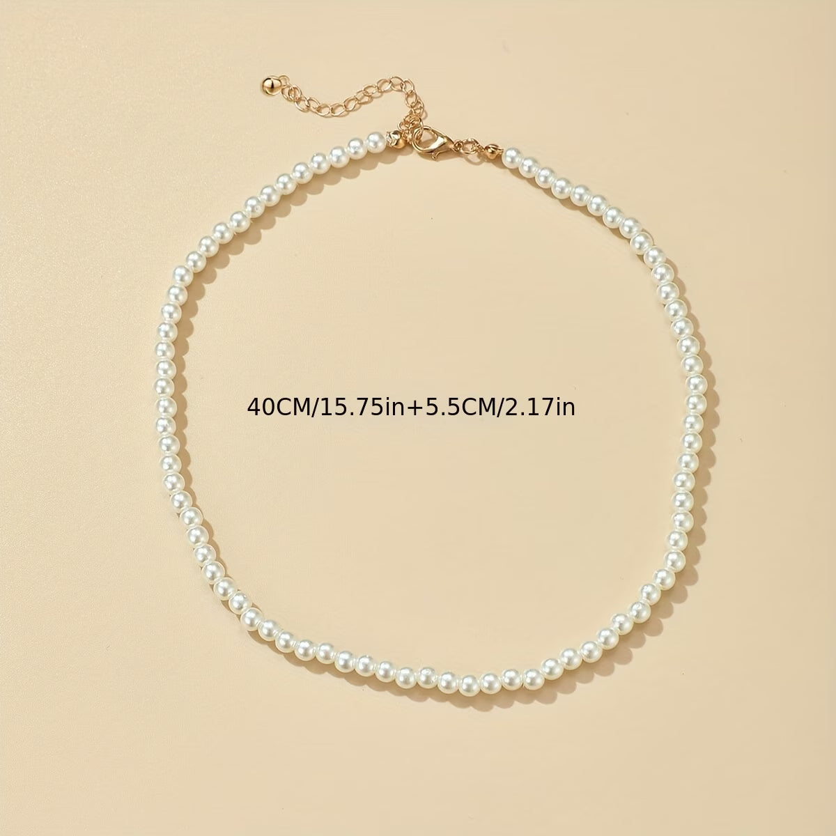 Pearl bead necklace with small gold clasp and delicate chain links