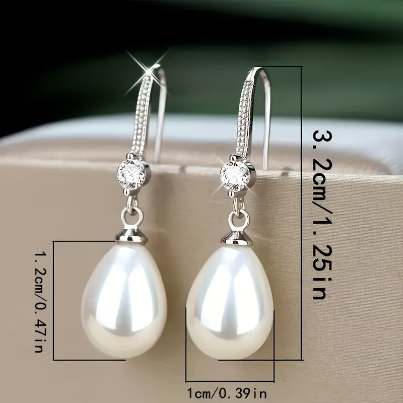 Pearl drop earrings, 3.25 in long, round crystal caps and silver hooks