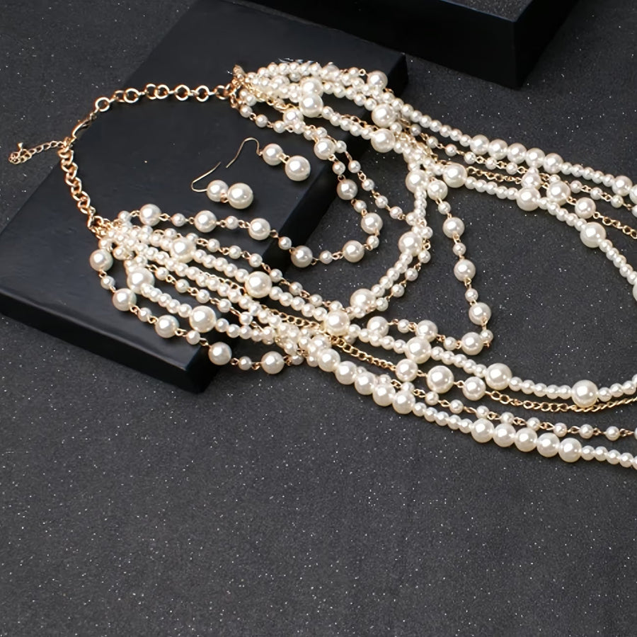 Boho multi-strand pearl necklace with gold-tone chain clasp and dangling loops