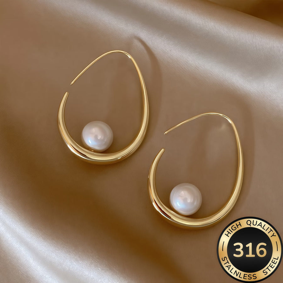 Gold crescent hoop earrings with white pearl drops, stainless-steel style.