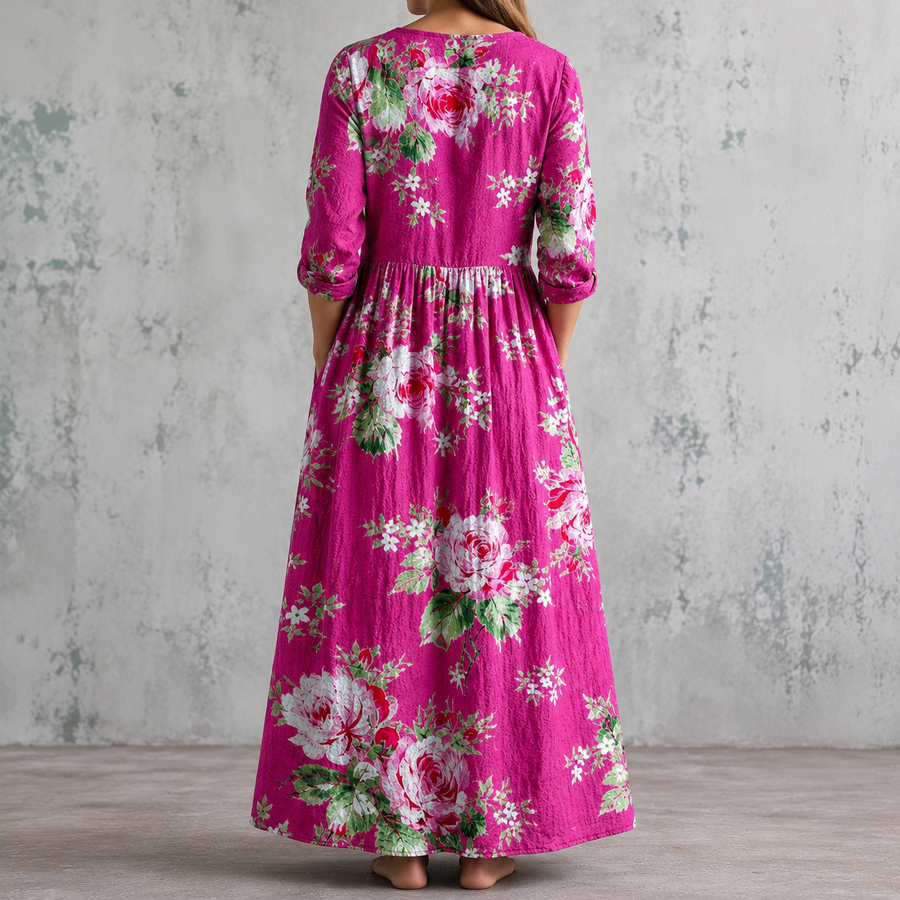 Magenta floral maxi dress with gathered waist, rose print, and 3/4 sleeves