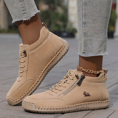 Beige zip-up comfort shoes with lace-up front and side zipper on feet