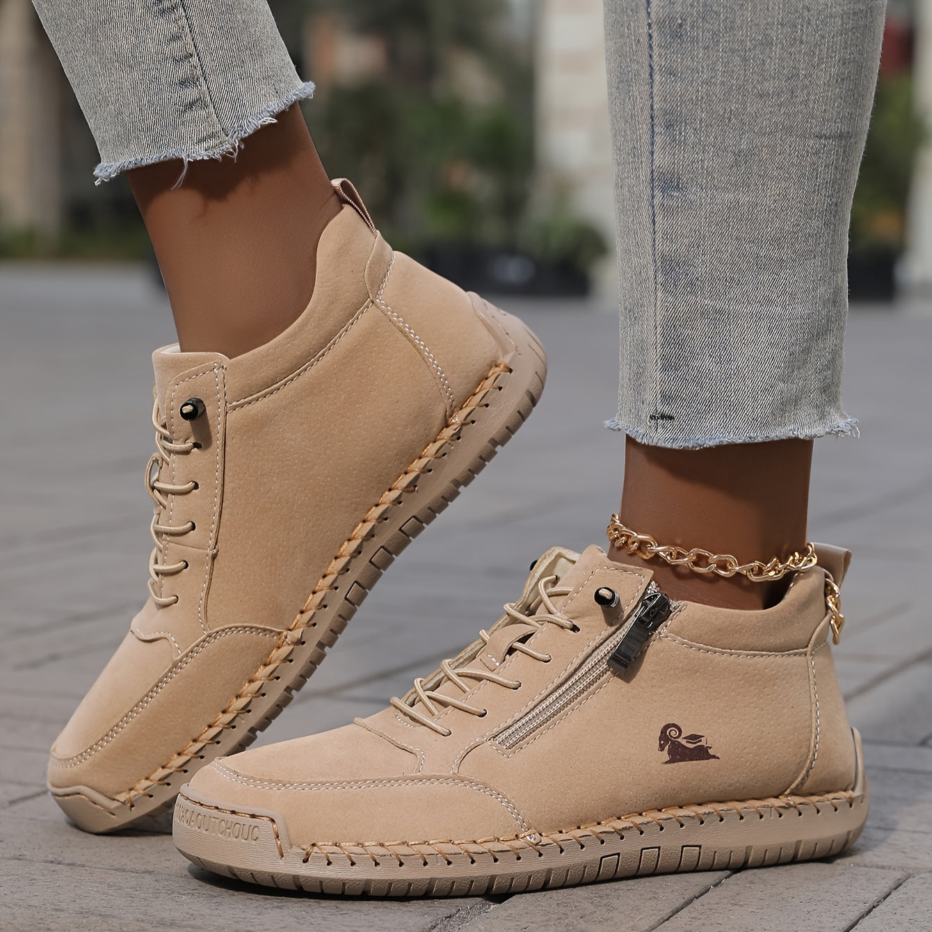 Beige zip-up comfort shoes with lace-up front and side zipper on feet