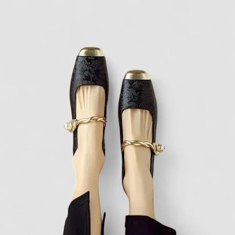 Orthopedic shoes, black textured upper with gold toe and heel caps, ankle bow strap