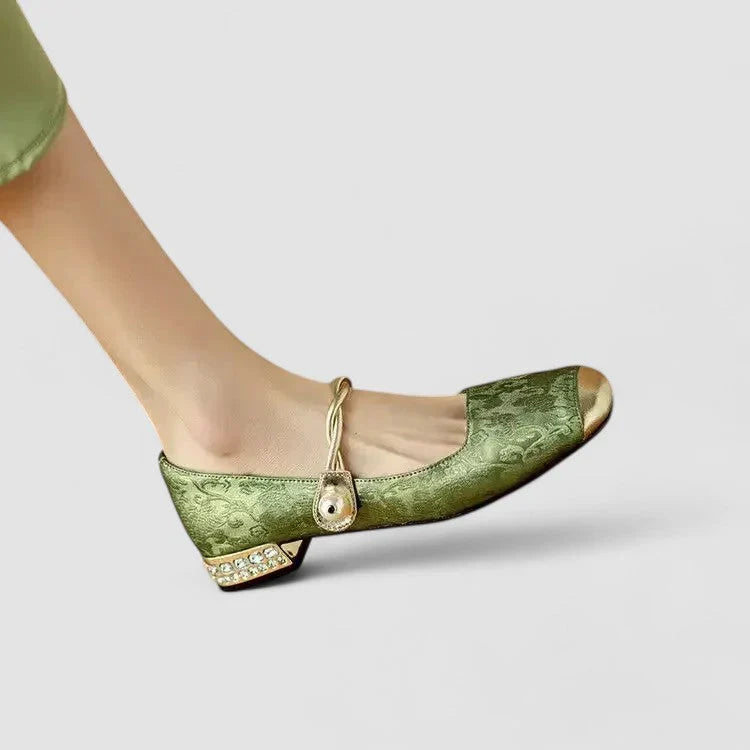 Green orthopedic Mary Jane flats with gold buckle strap and low block heel, rounded toe