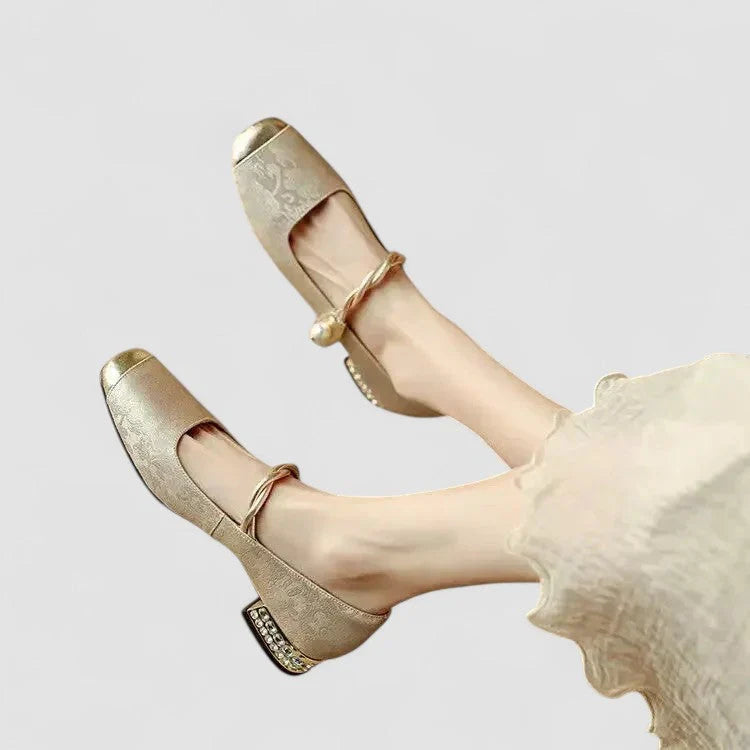 Beige orthopedic Mary Jane shoes with gold strap and low block heel, rounded open toe