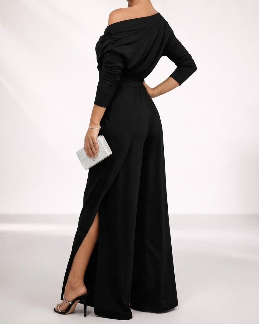 Black one-shoulder overlay jumpsuit with off-shoulder drape and side-slit wide legs.
