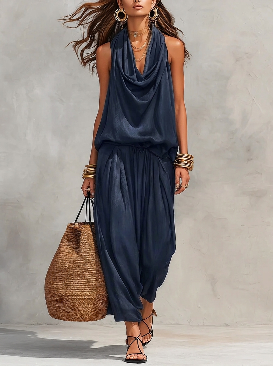 Navy blue two-piece set with sleeveless draped cowl-neck top and gathered maxi skirt