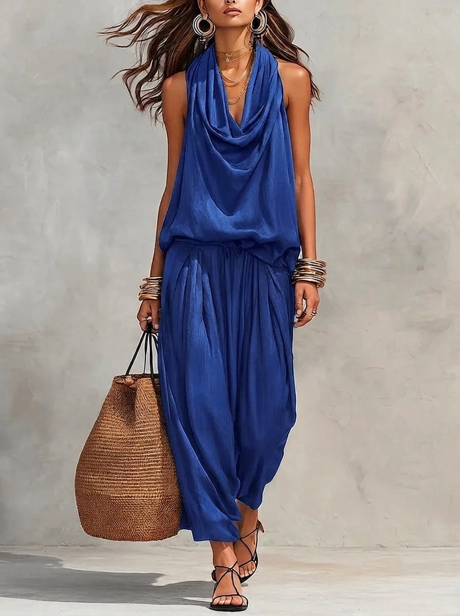 Blue two-piece set with sleeveless draped cowl-neck top and gathered maxi skirt