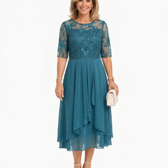 Teal lace midi dress with short sleeves, fitted waist, and layered ruffle hem