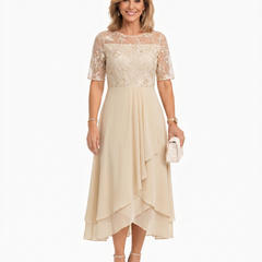 Cream lace midi dress with short sleeves, fitted waist, and layered asymmetrical ruffle hem