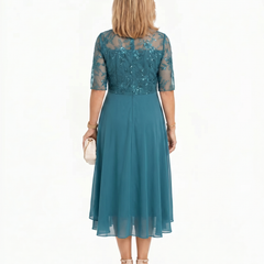 Teal lace midi dress with short sleeves and layered ruffle hem, back view