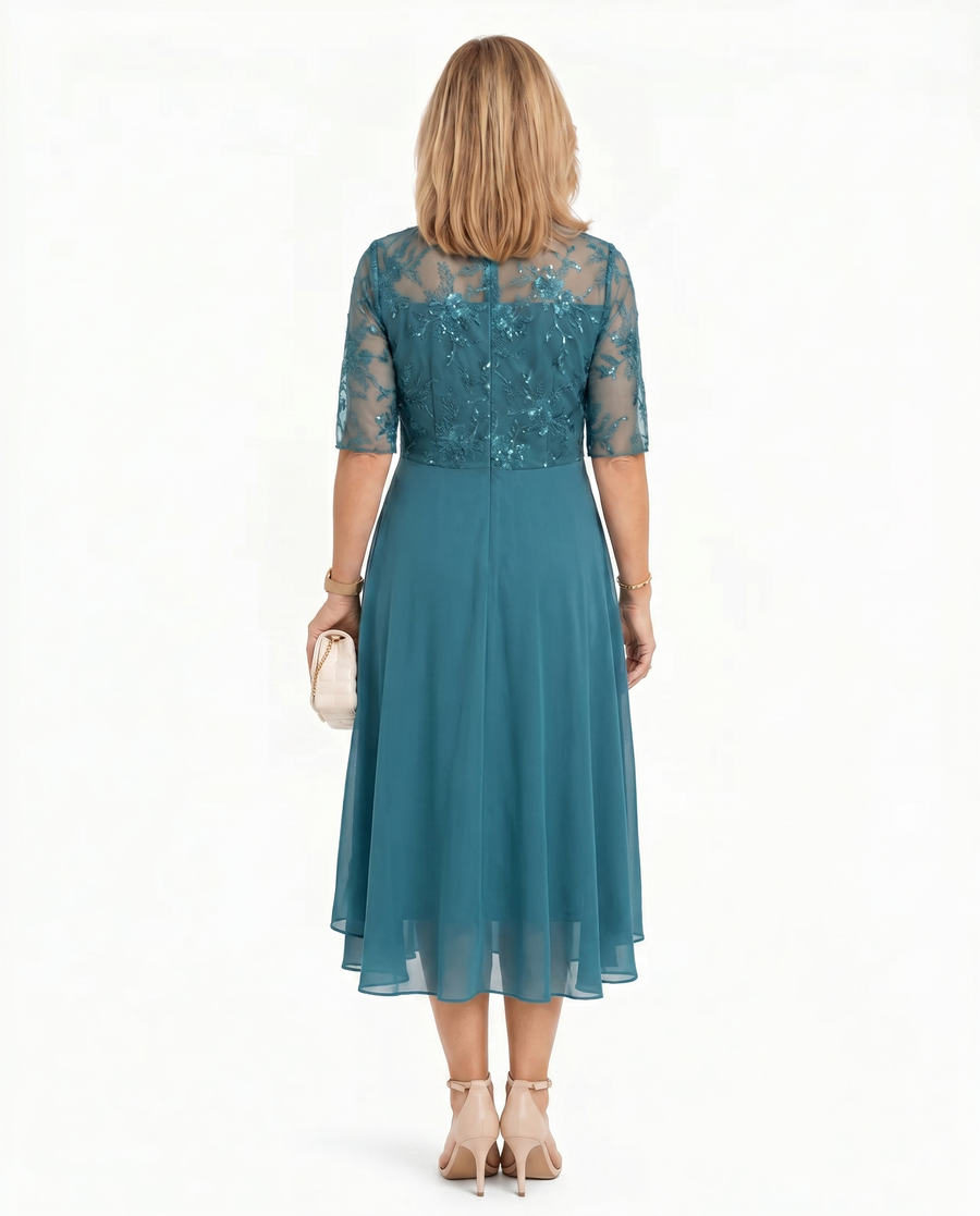 Teal lace midi dress with short sleeves and layered ruffle hem, back view