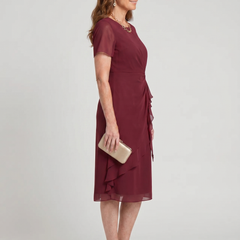 Elegant chiffon draped dress in bordeaux, side view with layered ruffle hem