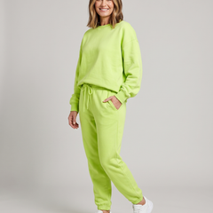 Solid round-neck sweater and drawstring trouser set in lime green.