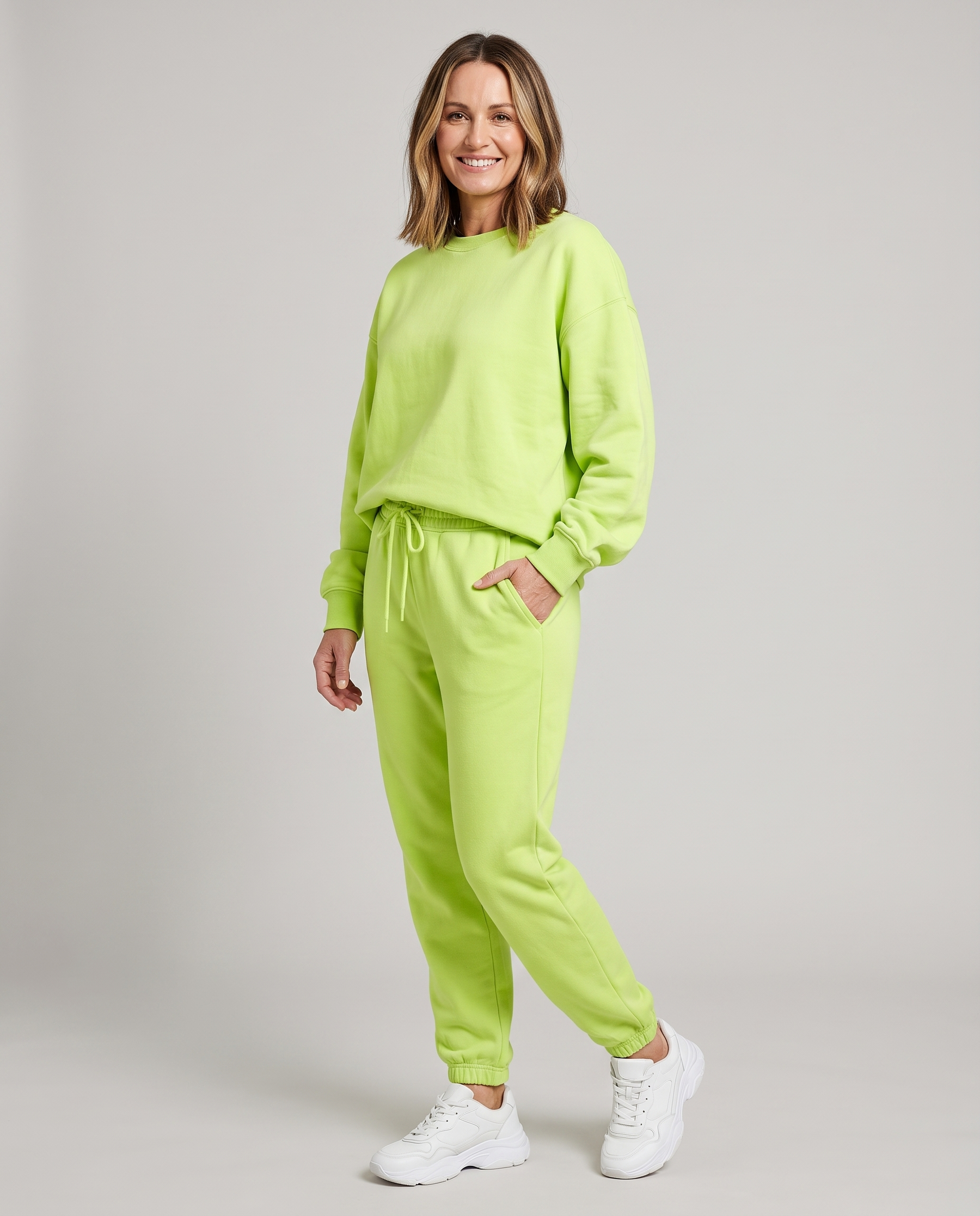 Solid round-neck sweater and drawstring trouser set in lime green.