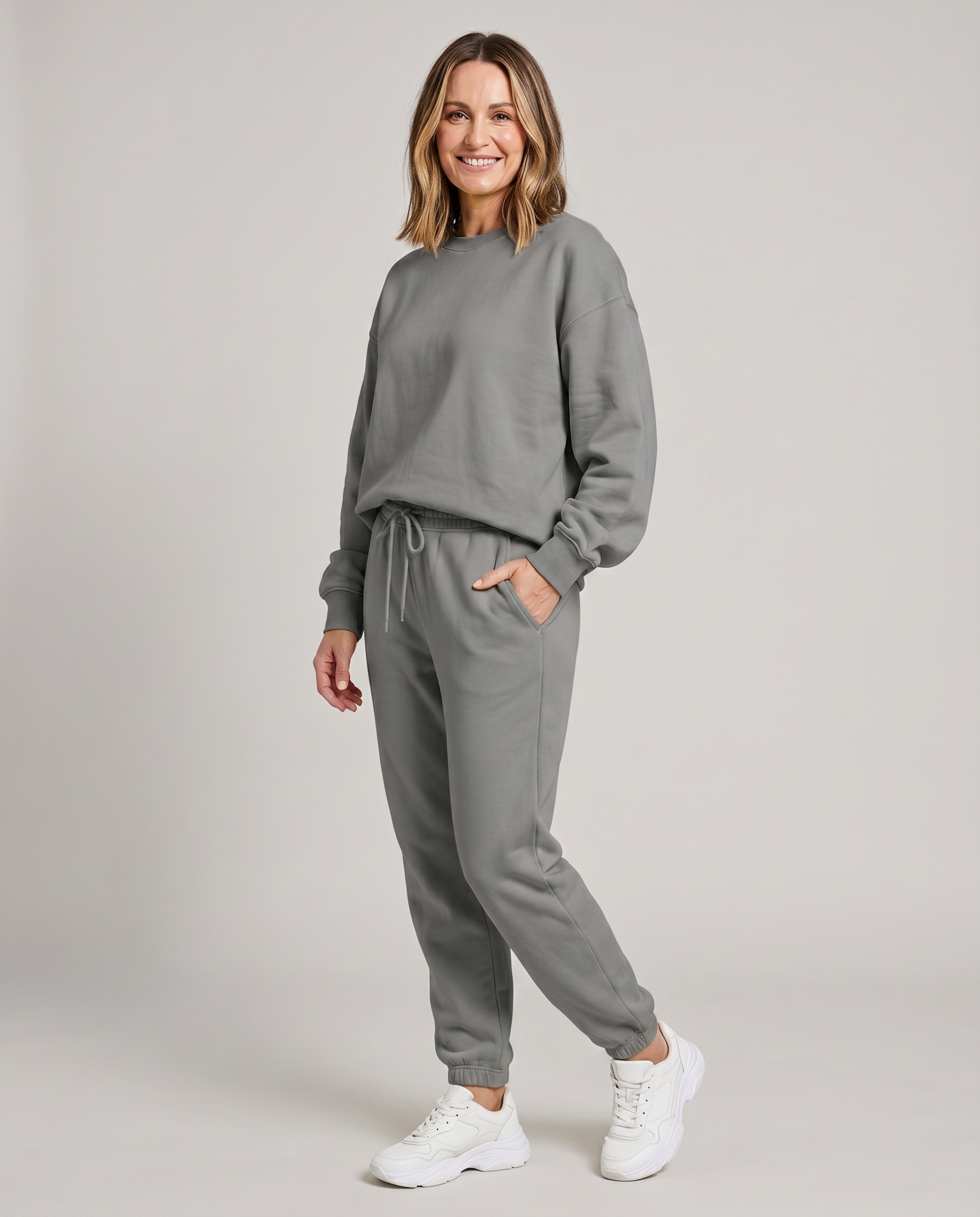 Solid round-neck sweater and drawstring trouser set in heather gray.