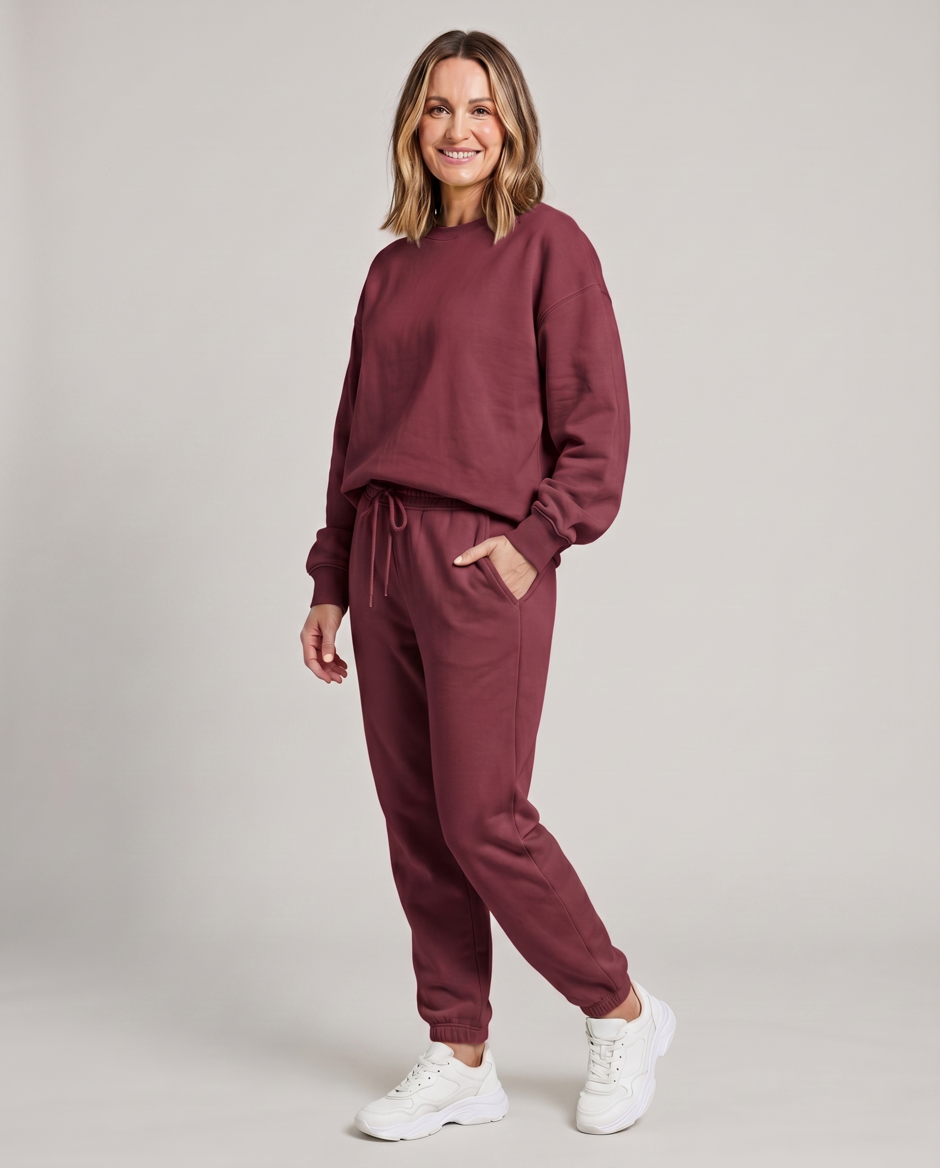 Solid round-neck sweater and drawstring trouser set in deep plum.