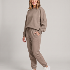 Solid round-neck sweater and drawstring trouser set in taupe.