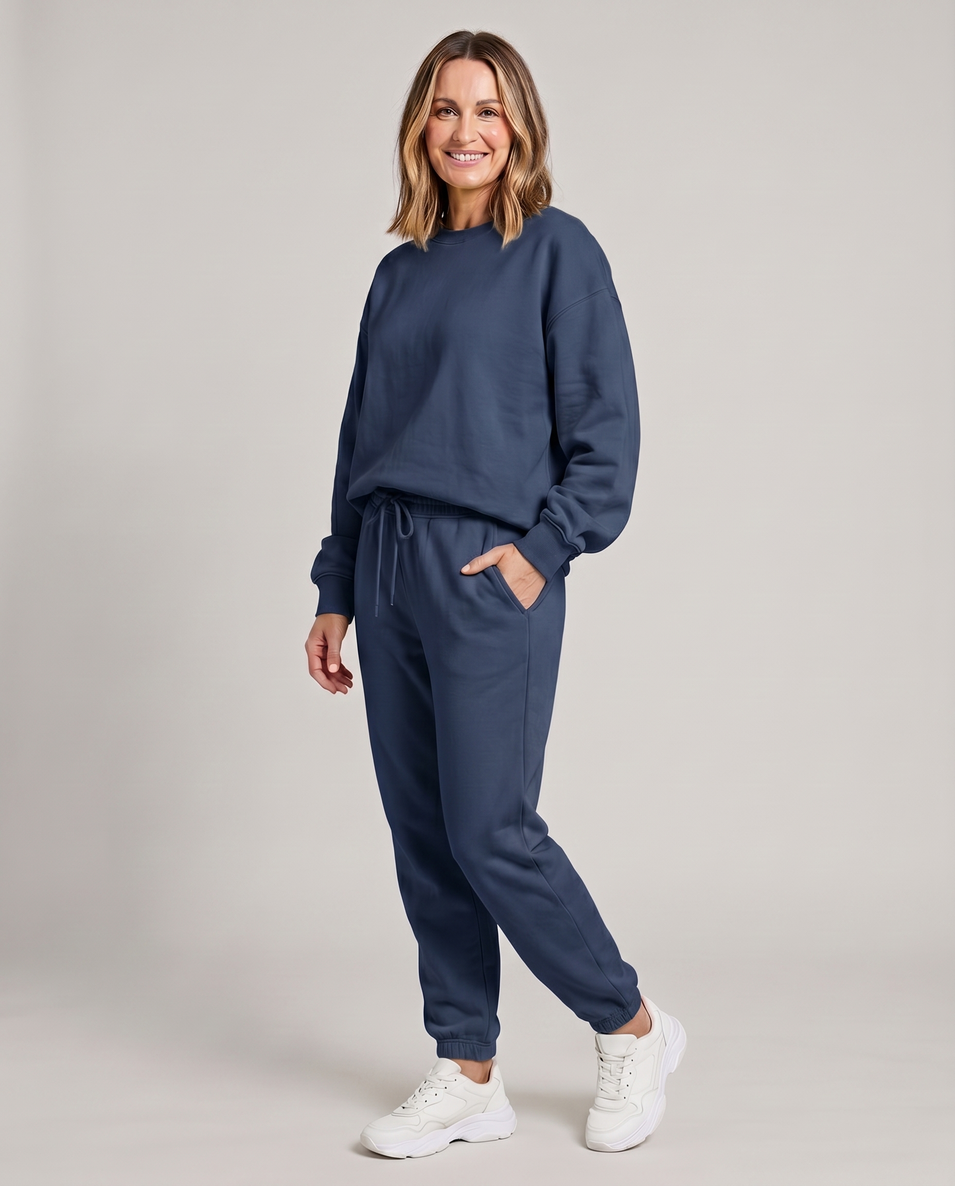 Solid round-neck sweater and drawstring trouser set in navy blue.