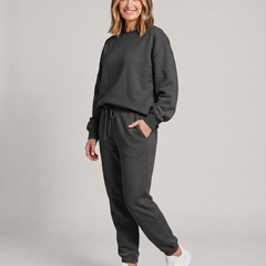 Solid round-neck sweater and drawstring trouser set in dark gray.