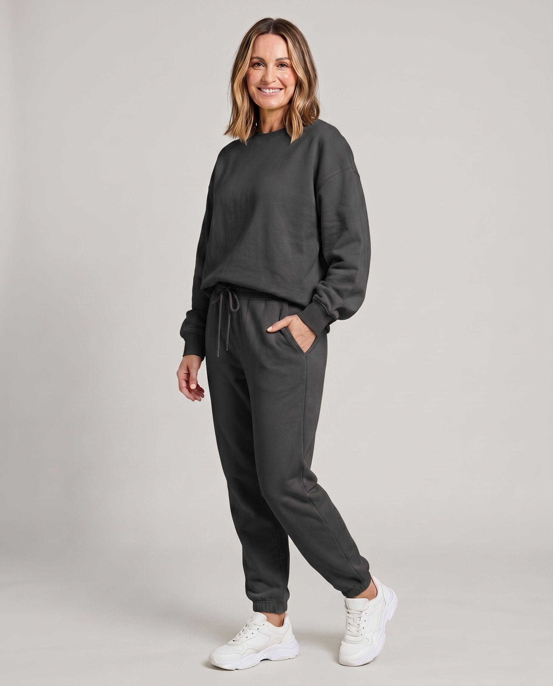 Solid round-neck sweater and drawstring trouser set in dark gray.