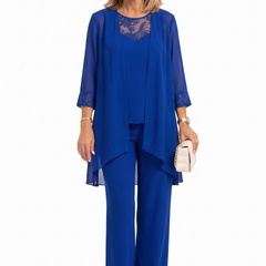 Blue three-piece outfit: lace-trim tunic over layered top and matching wide-leg pants