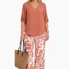 Rust V-neck top and wide-leg pants set with palm-leaf print