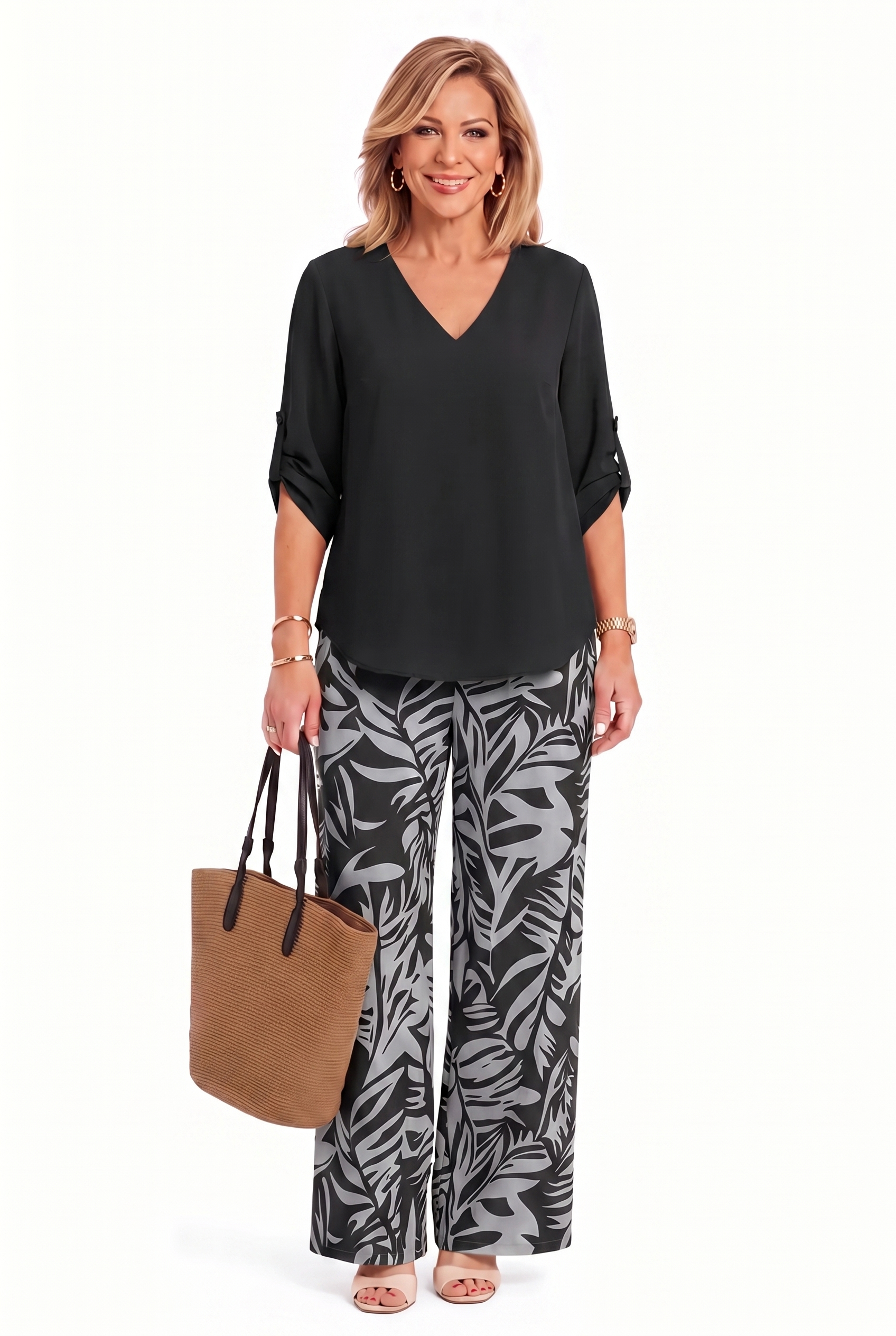 Black V-neck top and wide-leg pants set with palm-leaf print