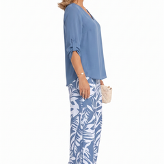 Blue V-neck top and wide-leg pants set with palm-leaf print, side view