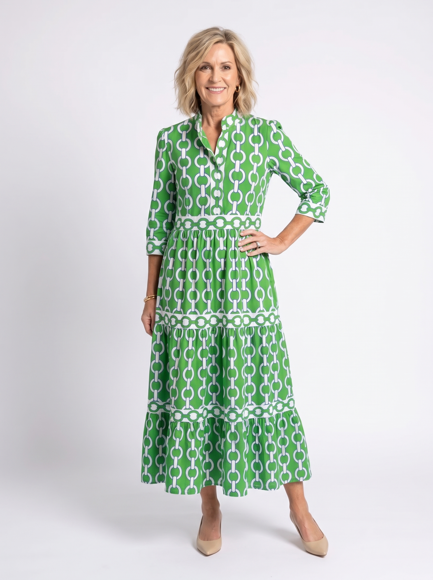 Green chain-link pattern midi dress with 3/4 sleeves and tiered skirt