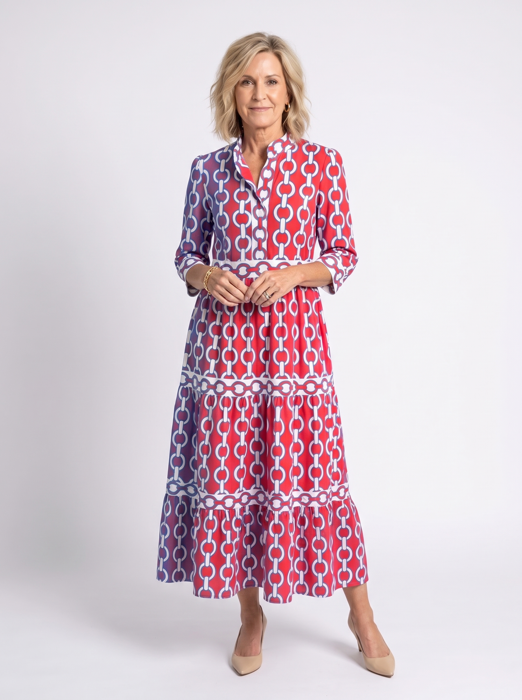 Red, white, and navy chain-link pattern midi dress with 3/4 sleeves and tiers