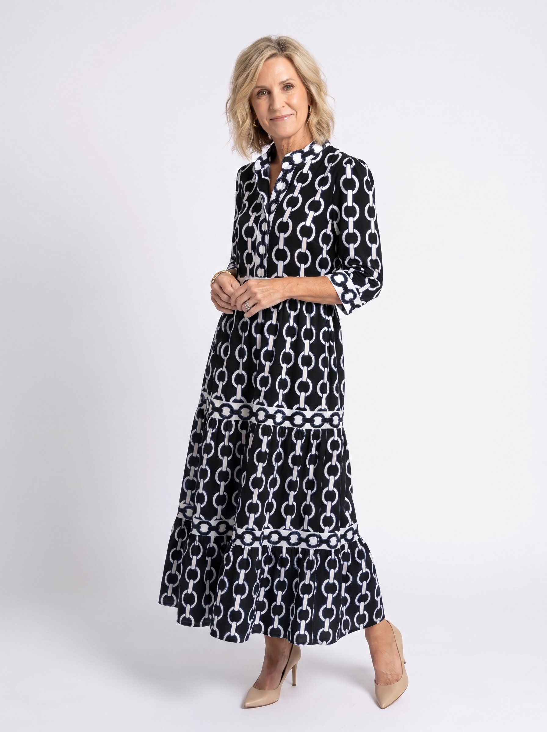 Black chain-link pattern midi dress with 3/4 sleeves and tiered skirt