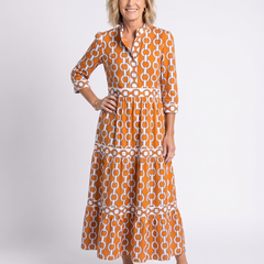 Orange and white chain-link pattern midi dress with 3/4 sleeves and tiered skirt