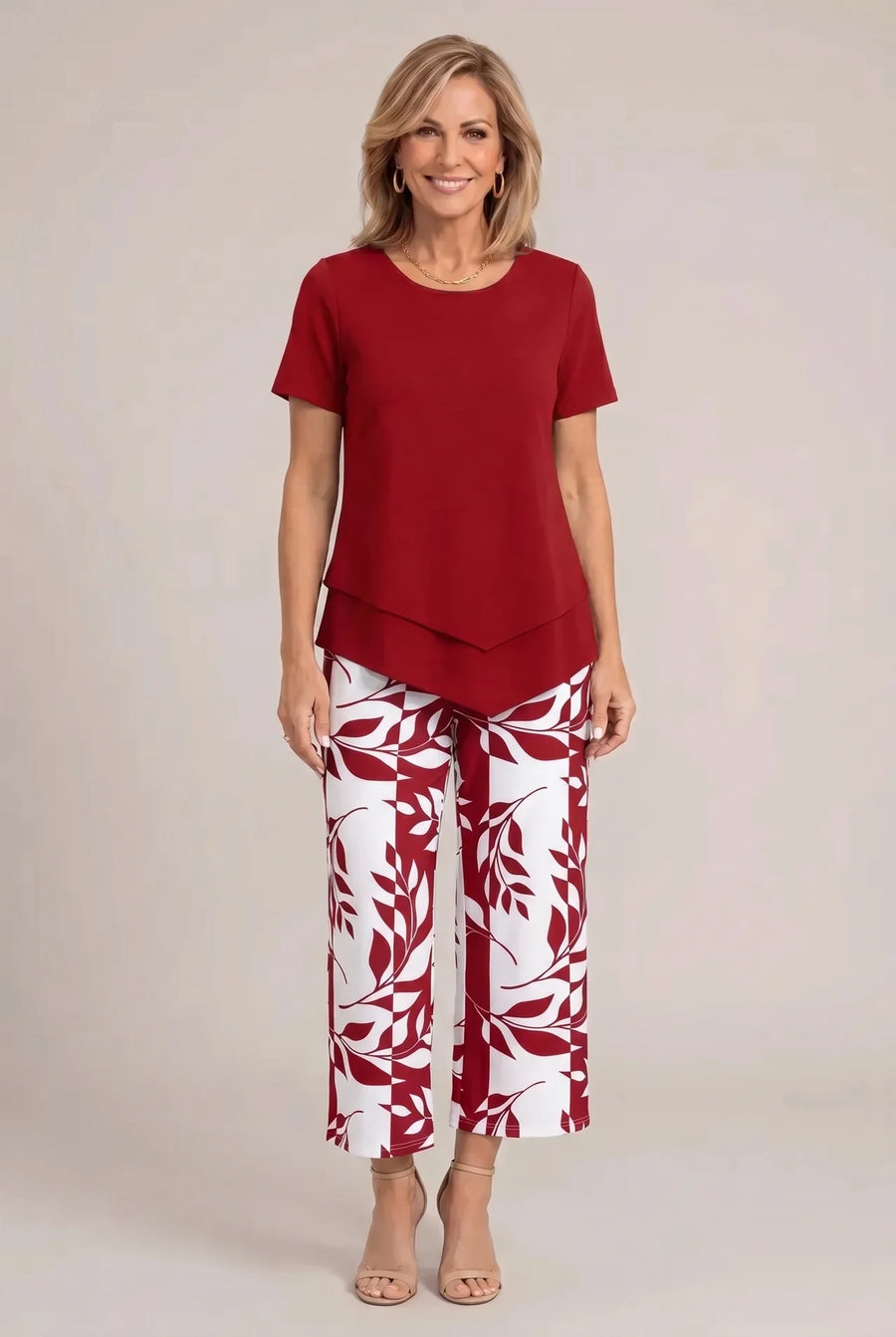 Red tailored two-piece wide-leg set with short-sleeve top and patterned pants