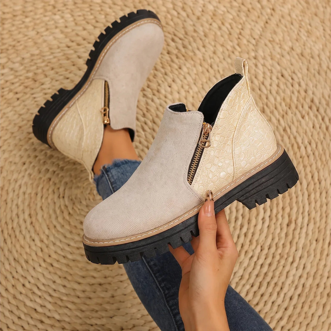 Women's ankle boots in light beige suede with side zipper, croc-texture panels, and lug sole