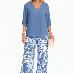 Blue V-neck top and wide-leg pants set with palm-leaf print