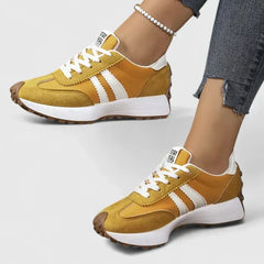 Brown-gold comfort sneakers with white side stripes and lace-up front, chunky sole