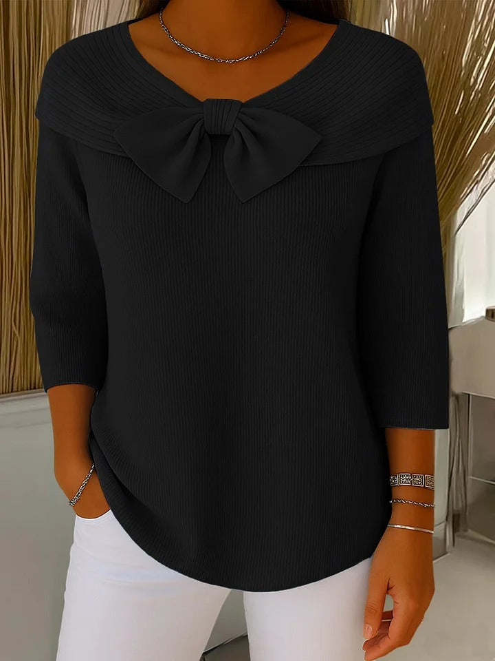 Black ribbed tunic with bow neckline and three-quarter sleeves