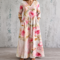 Floral summer dress with V-neck, gathered waist, and 3/4 sleeves in pink and cream