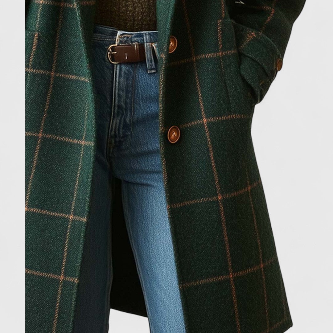 Dark green plaid long coat front close-up with button details and side pockets