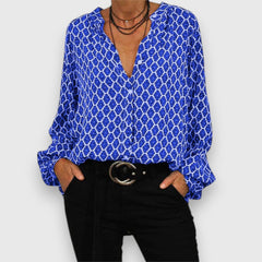 Long-sleeve blouse with blue-and-white geometric pattern, V-neck, relaxed fit